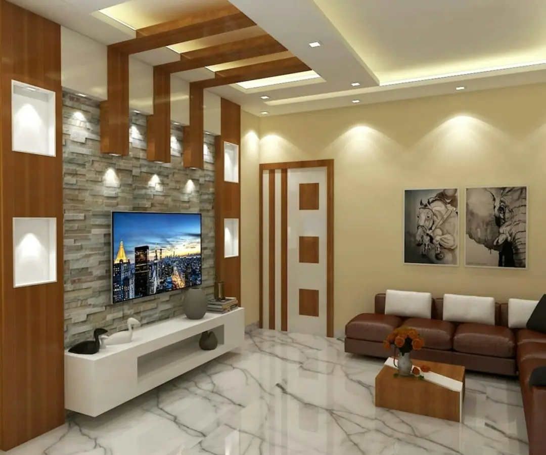 A bright living room with a wall-mounted TV above a white media unit, where a Fire TV Stick plugs in to run GaroxTV